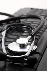 Image showing stethoscope on computer keyboard