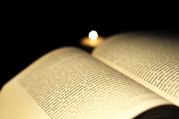 Image showing book and candle