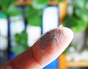 Image showing dust and finger