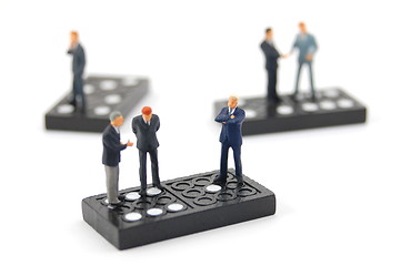 Image showing business man on domino 