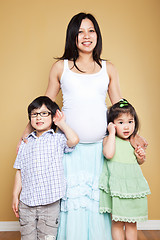 Image showing Pregnant Asian mother and her kids