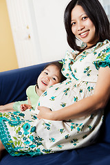 Image showing Pregnant Asian mother and her daughter