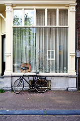 Image showing Amsterdam - typical window with parked bike