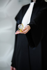 Image showing Barrister in wig holding globe in hand