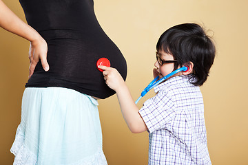 Image showing Pregnant Asian mother and her son