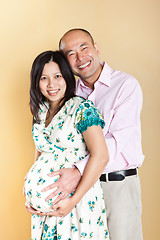 Image showing Pregnant Asian woman and her husband