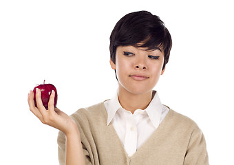 Image showing Pretty Hispanic Young Adult Female Looking at Apple