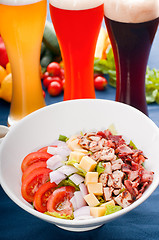 Image showing fresh classic caesar salad with selection of beer