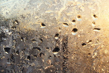 Image showing frozen water drops and sunlight on winter glass