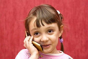 Image showing The girl speaks by phone