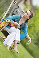 Image showing Young woman relaxing on nature
