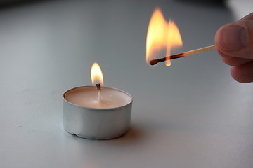 Image showing Lighting a candle