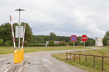 Image showing Stop sign and clearway sign near barrier gate