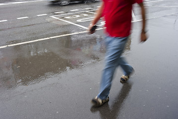 Image showing Urban shopping in the rain