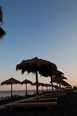 Image showing Sunbeds in Perissa, Santorini, Greece