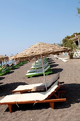 Image showing Sunbeds in Perissa, Santorini, Greece