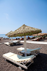 Image showing Sunbeds in Perissa, Santorini, Greece