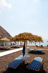 Image showing Sunbeds in Perissa, Santorini, Greece