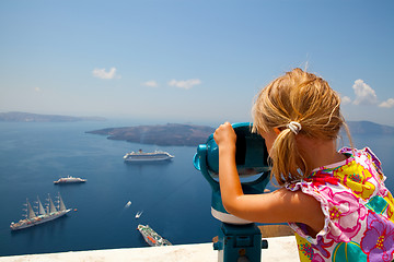 Image showing Girl looking with binoculars in Thira, Santorini, Greece