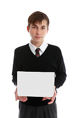 Image showing Teen boy holding sign, book or other object