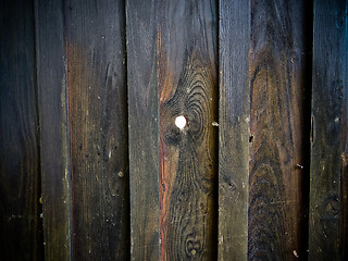 Image showing Wooden fence with spyhole