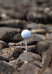 Image showing Golf ball on the rocks