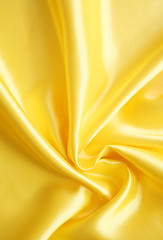 Image showing Smooth elegant golden silk can use as background 