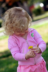 Image showing Girl and dandelion