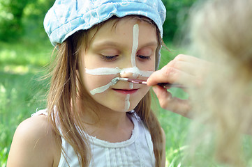 Image showing painting a face mask