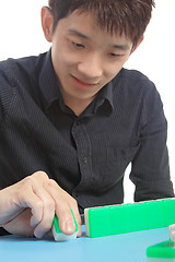 Image showing Chinese man play Mahjong, traditional China gamble. 