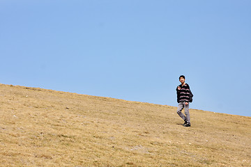 Image showing man walking on the mountain