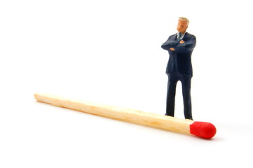 Image showing business man and matches on white