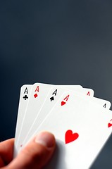 Image showing hand holding four aces