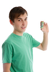 Image showing Teenager holding some money