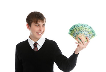 Image showing Happy student or young worker holding cash