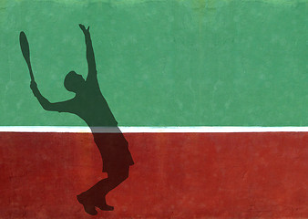 Image showing Tennis Player Serving Silhouette Against Practice Wall