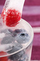 Image showing Raspberry and blackberry frozen in ice sticks