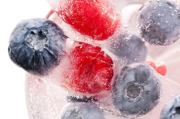 Image showing Raspberry and blackberry frozen in ice sticks