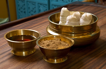 Image showing herbs powder and oil in bronze cups