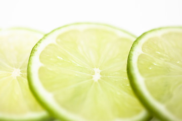 Image showing Slices of lime fruit on white