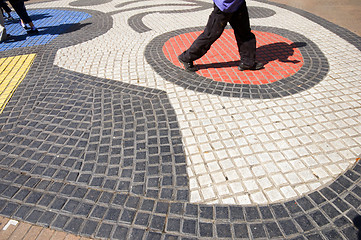 Image showing people walking tile mosaic art work on La Rambla Barcelona Spain