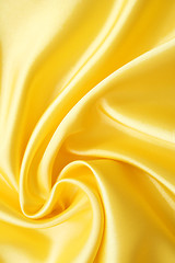 Image showing Smooth elegant golden silk can use as background 