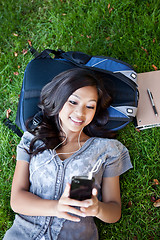 Image showing Asian college student listening to music