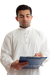 Image showing Ethnic business man writing 