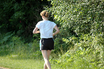Image showing Lone woman jogging