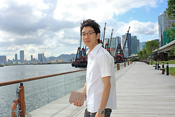 Image showing asia man relax in the park in the city 