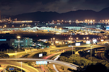 Image showing Freeway in night with cars light in modern city. 