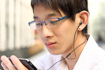 Image showing Businessman Using a Hands Free Device 