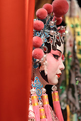 Image showing chinese opera dummy and red cloth as text space ,it is a toy,not