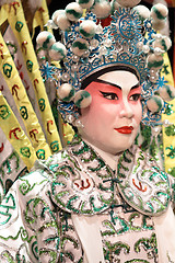 Image showing chinese opera dummy and red cloth as text space ,it is a toy,not